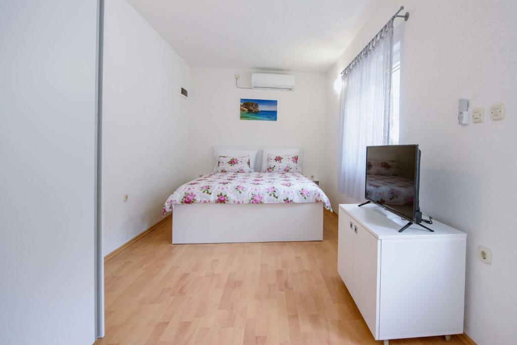Postel nebo postele na pokoji v ubytování Villa Kathi