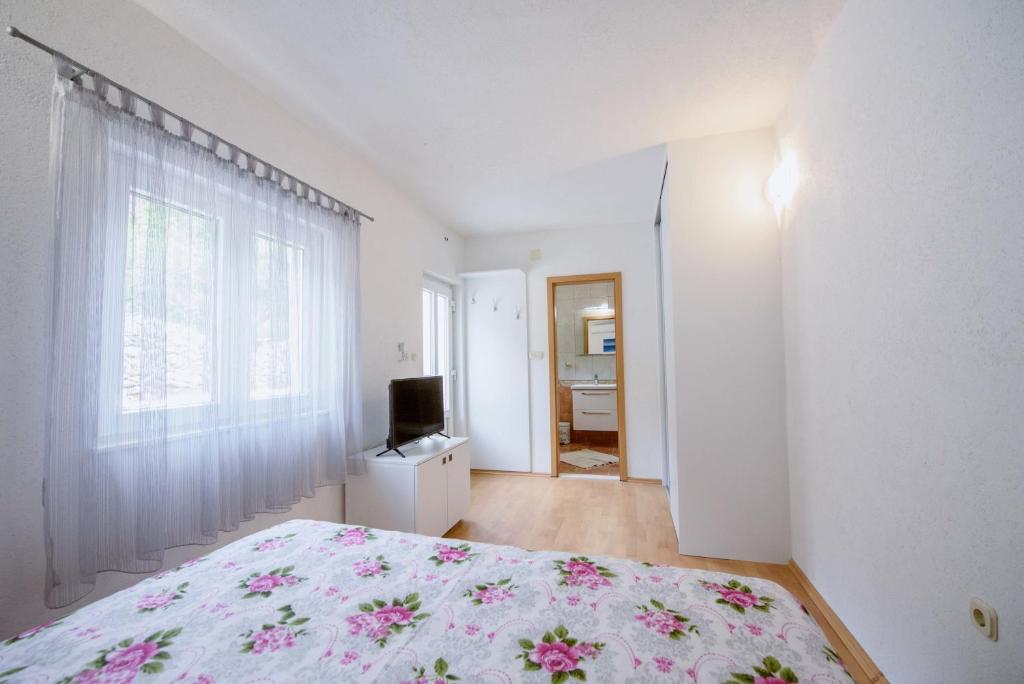 Postel nebo postele na pokoji v ubytování Villa Kathi