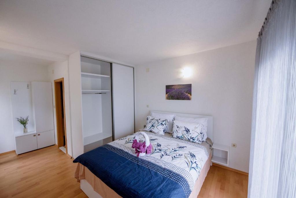 Postel nebo postele na pokoji v ubytování Villa Kathi