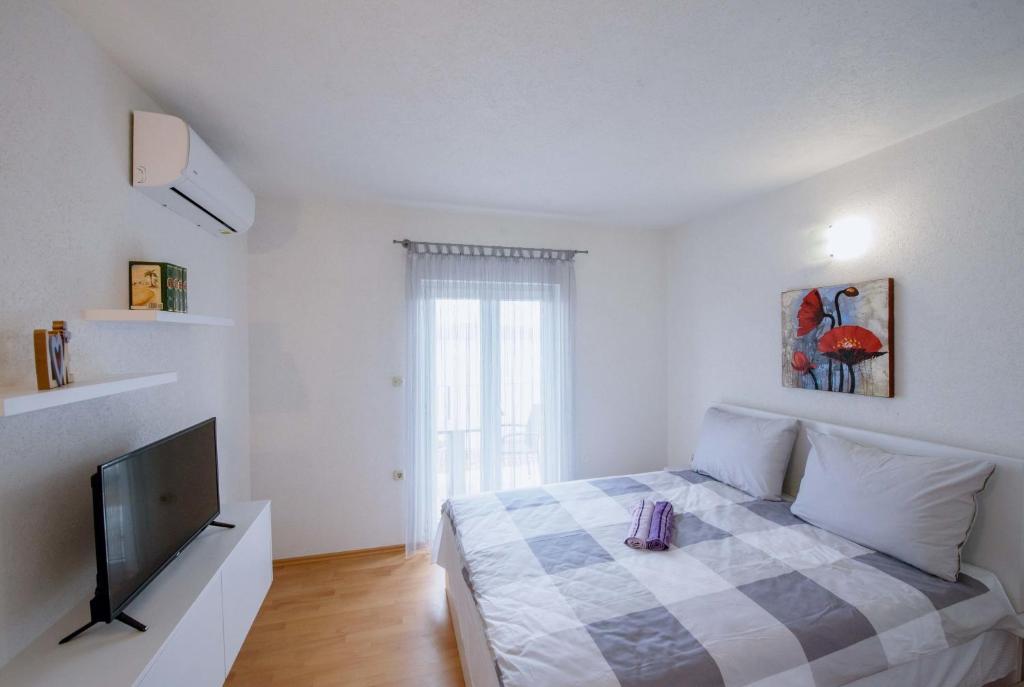 Postel nebo postele na pokoji v ubytování Villa Kathi