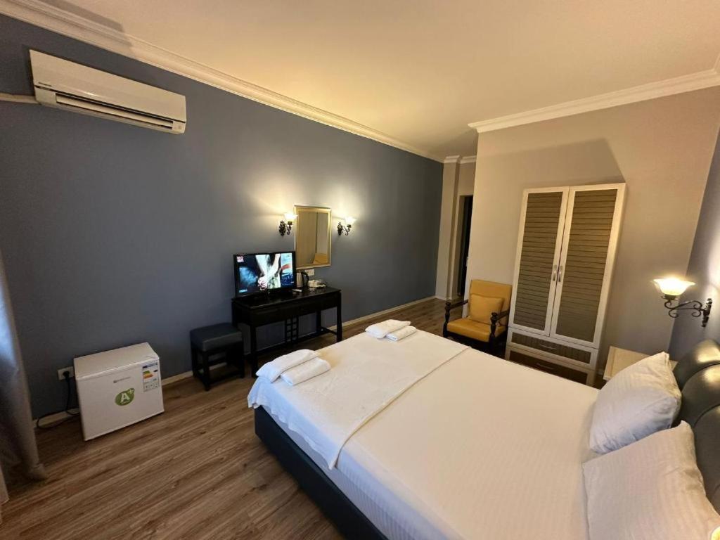 Postel nebo postele na pokoji v ubytování Akkent Garden Hotel