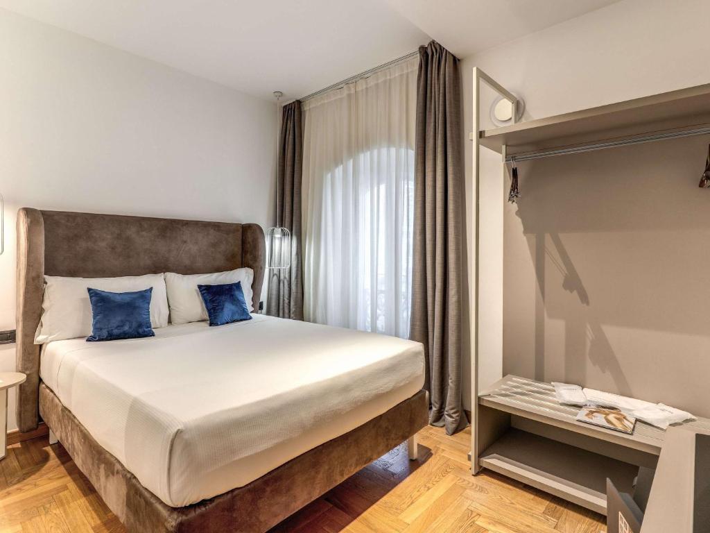 Postel nebo postele na pokoji v ubytování Mercure Roma Centro Termini