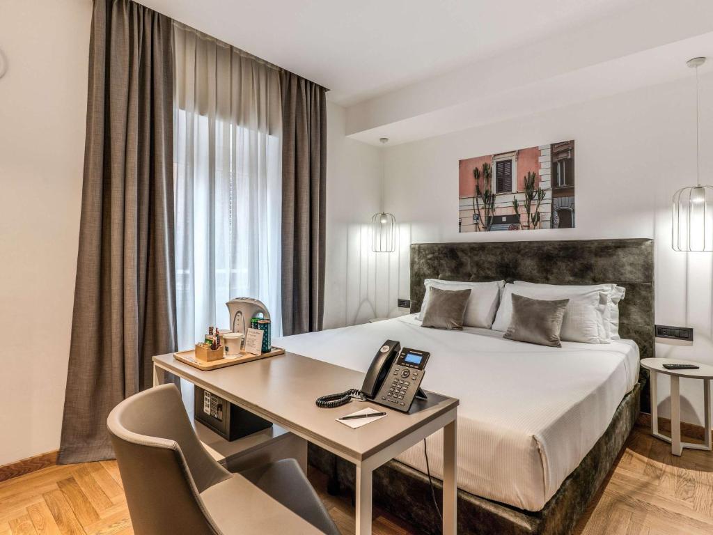 Postel nebo postele na pokoji v ubytování Mercure Roma Centro Termini