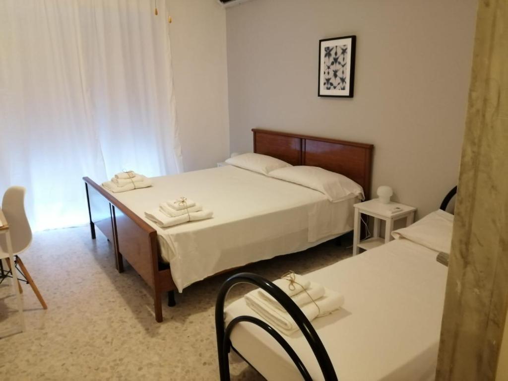 Posteľ alebo postele v izbe v ubytovaní Gatto Bianco Picone 19