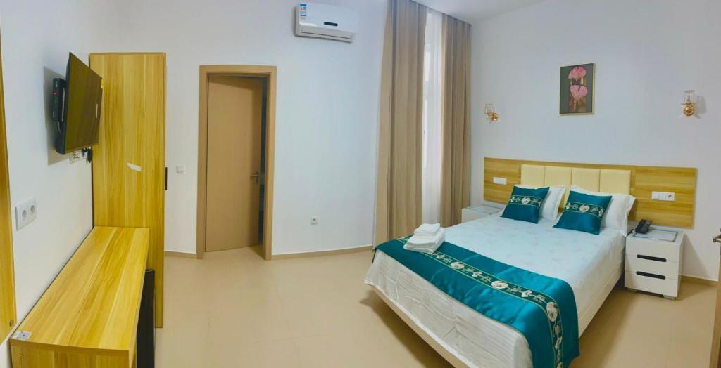 Postel nebo postele na pokoji v ubytování Lily holiday hotel