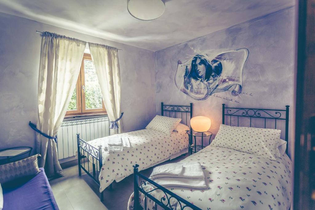 Letto o letti in una camera di Nostra Signora Del Lago