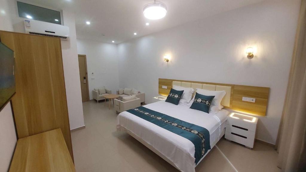 Postel nebo postele na pokoji v ubytování Lily holiday hotel