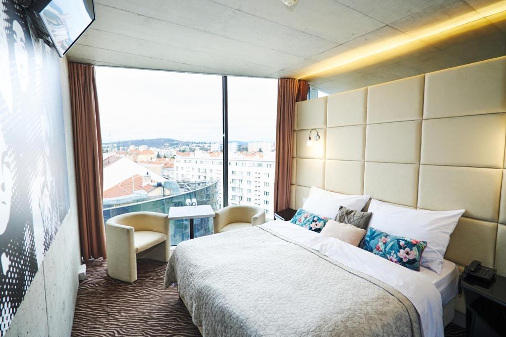 Llit o llits en una habitació de SONO hotel