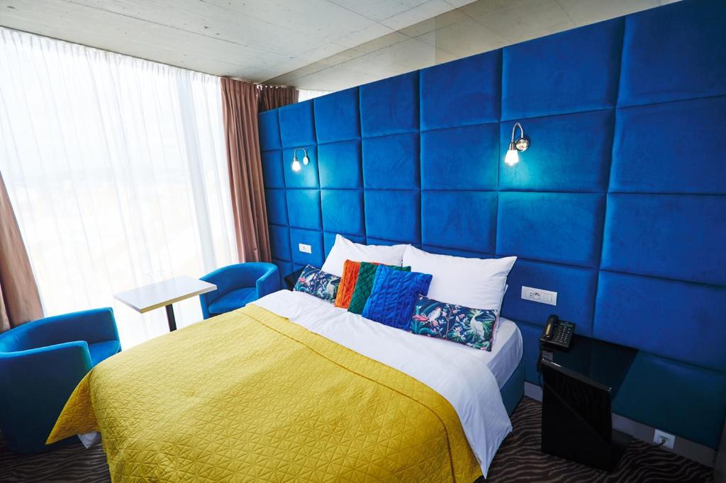 Llit o llits en una habitació de SONO hotel