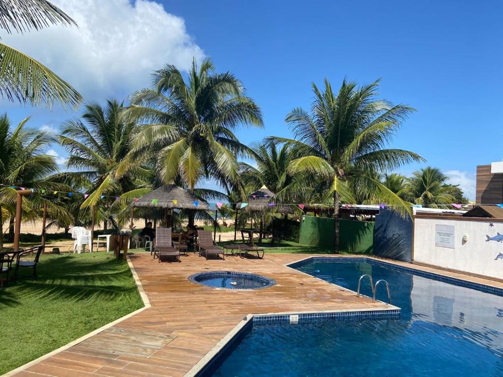 Bazén v ubytování Vilagge PÉ NA AREIA - Itacimirim Bahia nebo v jeho okolí