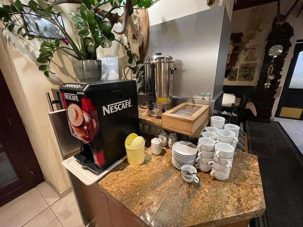 Kuchyň nebo kuchyňský kout v ubytování Hotel Club