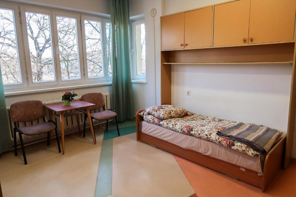 Postel nebo postele na pokoji v ubytování Dom Studencki Labirynt