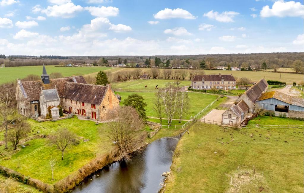 an aerial view of a village with a river at Lovely Home In Les Baux De Breteuil in Les Baux-de-Breteuil