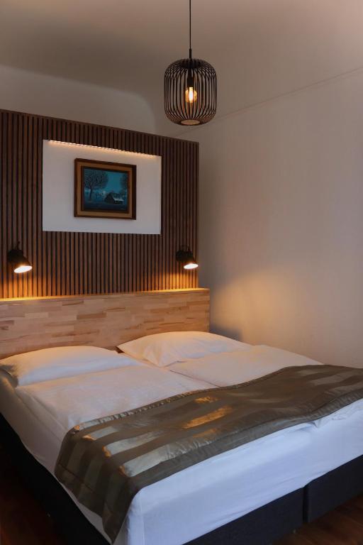 Postel nebo postele na pokoji v ubytování Hotel Europe
