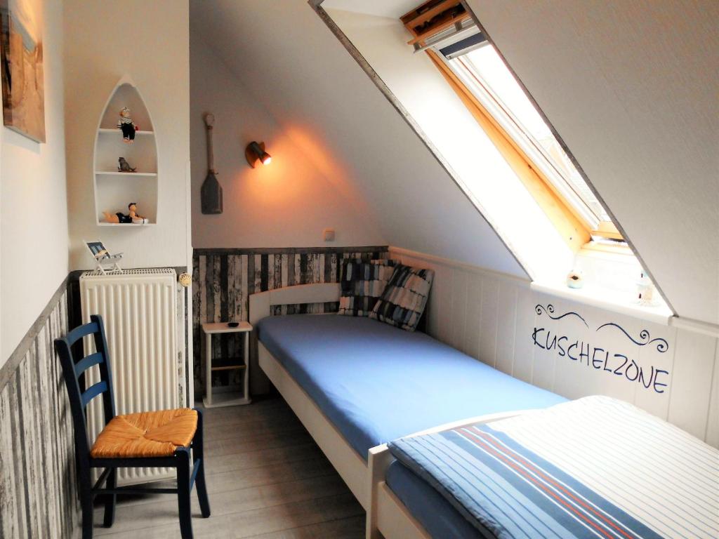 Postel nebo postele na pokoji v ubytování " HAUS ROSI " - Reihenhaus 2 - Strandnah - Ruhig - WLAN - Parkplatz - Grillplatz -Waschmaschine -