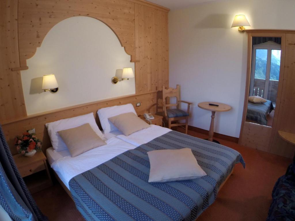 Postel nebo postele na pokoji v ubytování Hotel Olympia