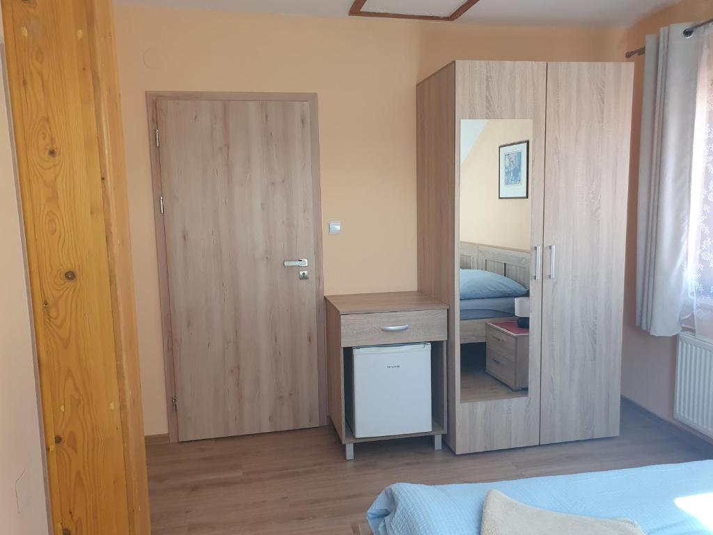 Postel nebo postele na pokoji v ubytování Pension Zelený strom