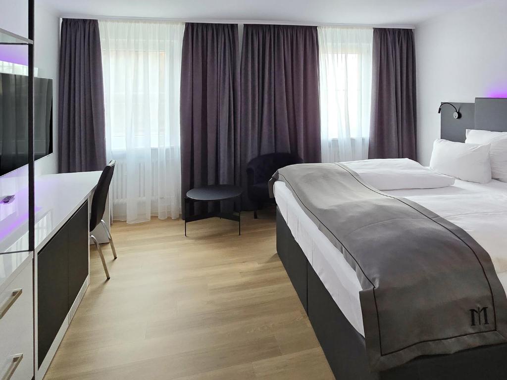 Postel nebo postele na pokoji v ubytování DORMERO Hotel Coburg