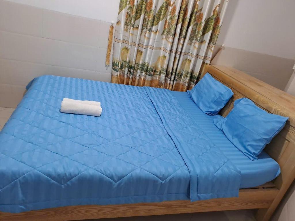 Postel nebo postele na pokoji v ubytování Khách sạn Hoàng Hải Ninh Thuận
