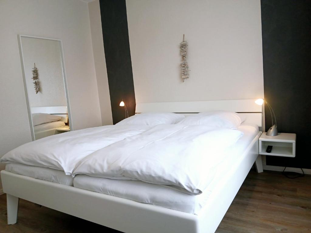 Postel nebo postele na pokoji v ubytování Haus Triton