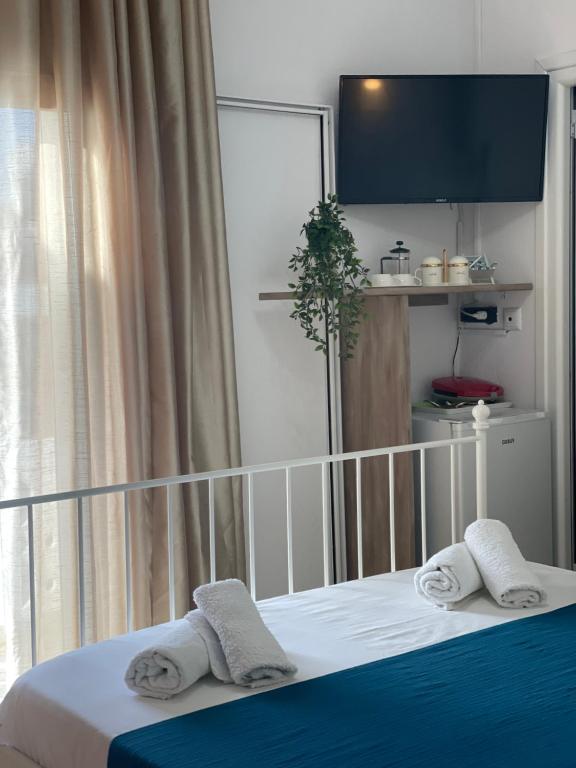 Postel nebo postele na pokoji v ubytování WHITE STUDIOS