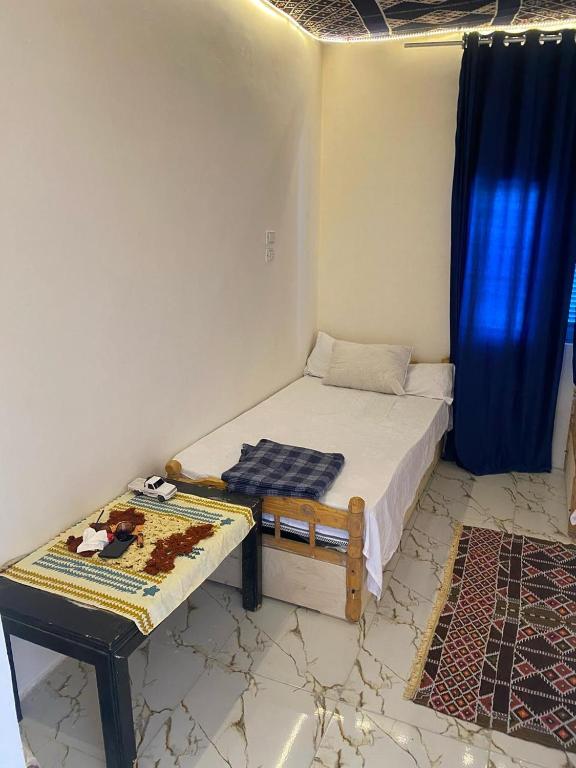 Postel nebo postele na pokoji v ubytování hooly nubian