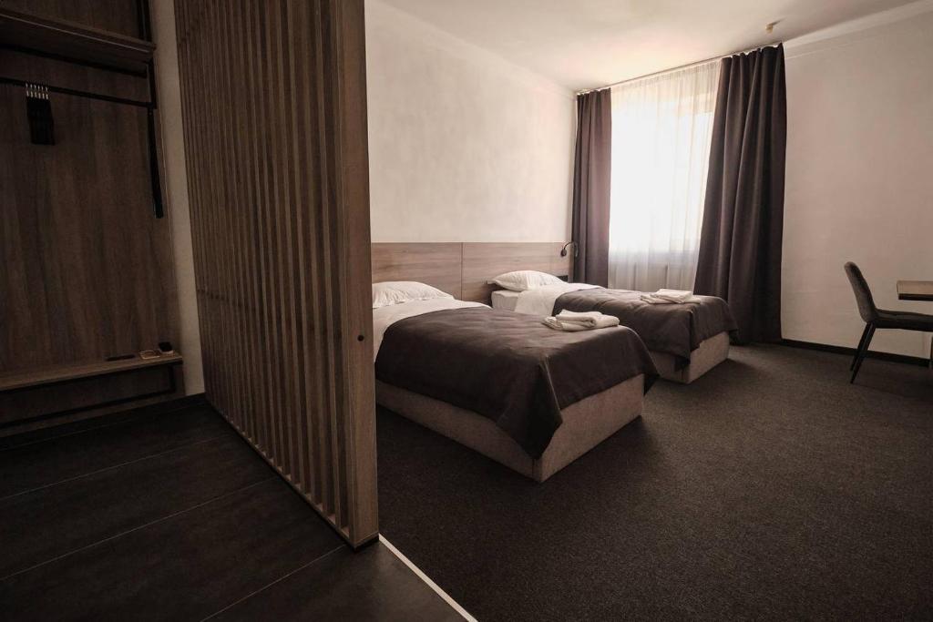 Postel nebo postele na pokoji v ubytování UNGVARSKIY Thermal Hotel