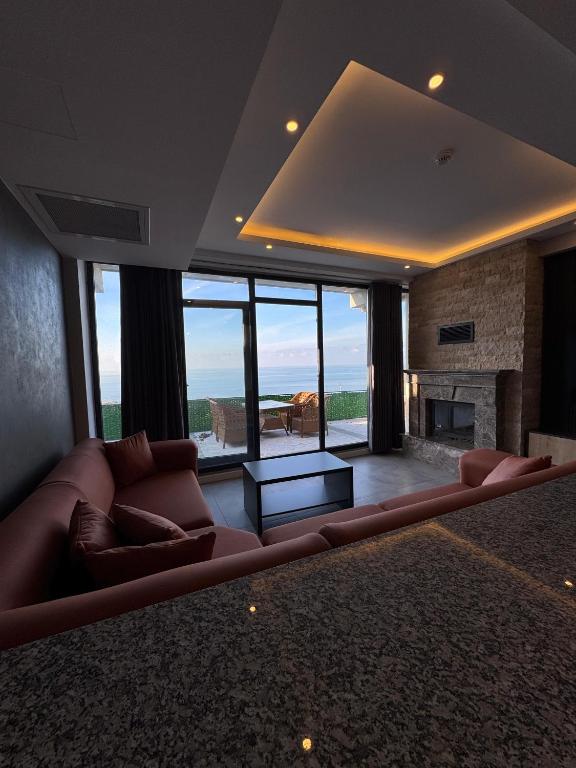 a living room with a couch and a fireplace at North Star Resort Hotel in Of