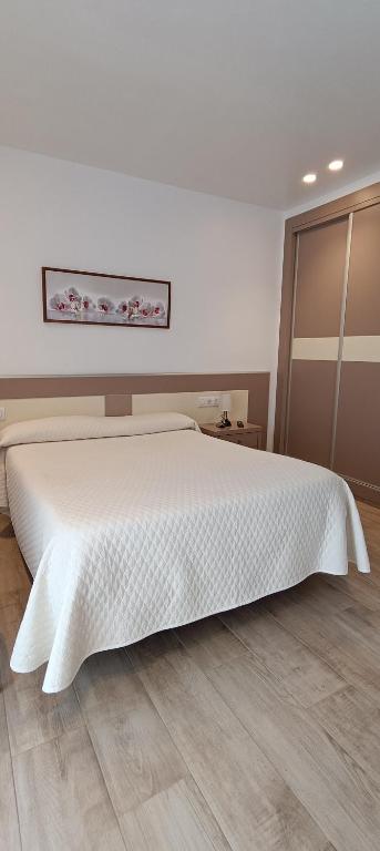 Posteľ alebo postele v izbe v ubytovaní Hostal Internacional