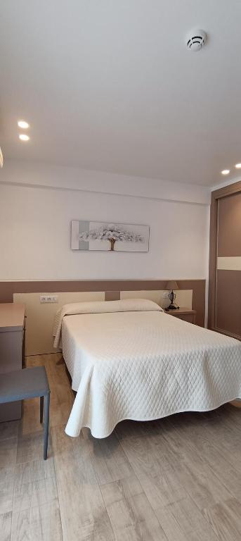 Posteľ alebo postele v izbe v ubytovaní Hostal Internacional