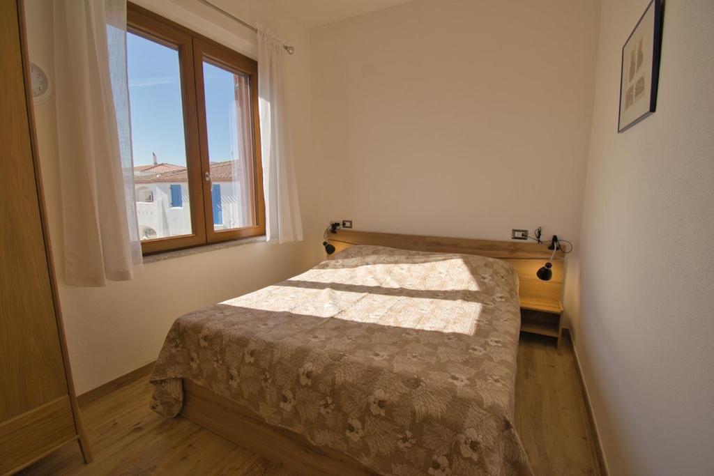 Postel nebo postele na pokoji v ubytování Dommu Livia