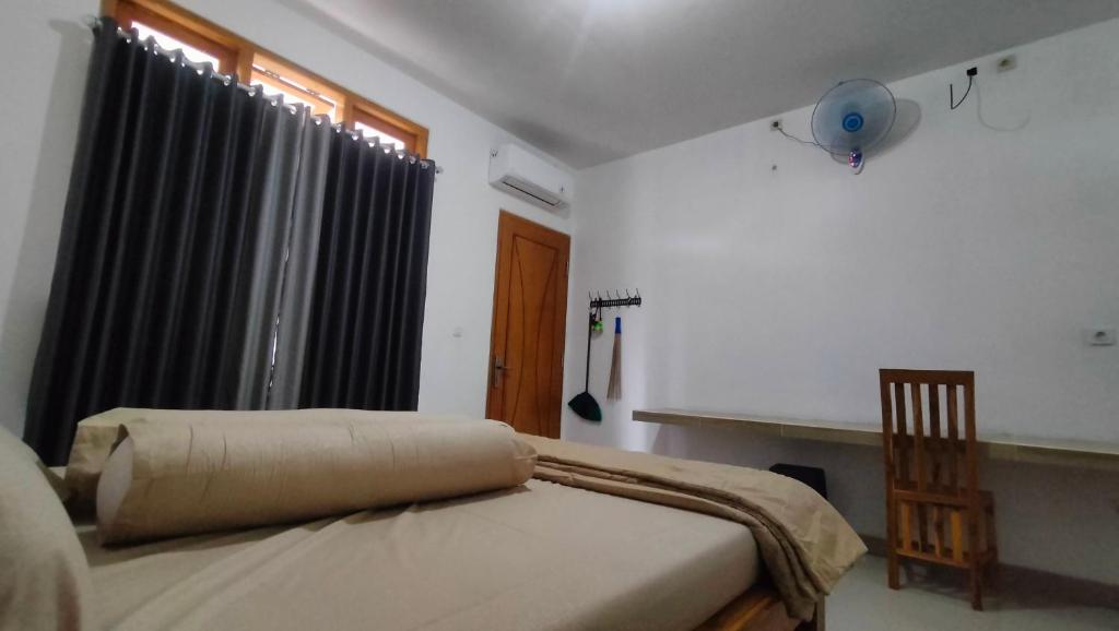 Postel nebo postele na pokoji v ubytování P'Moon Open Inn