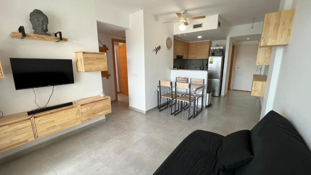 Televízia a/alebo spoločenská miestnosť v ubytovaní Apartamento acogedor con piscina en Santa Margarita
