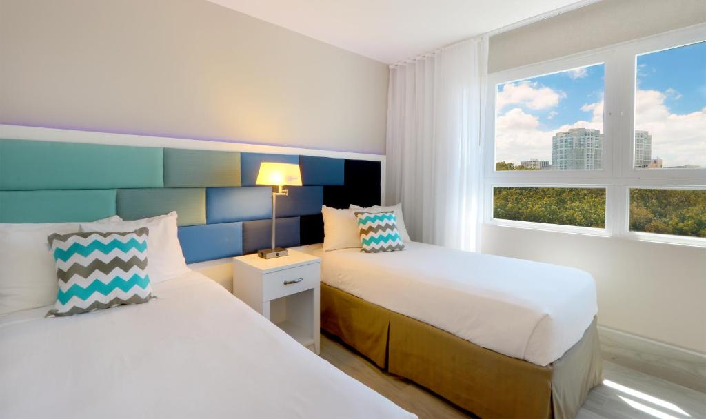 Postel nebo postele na pokoji v ubytování The Wave Hotel Condado