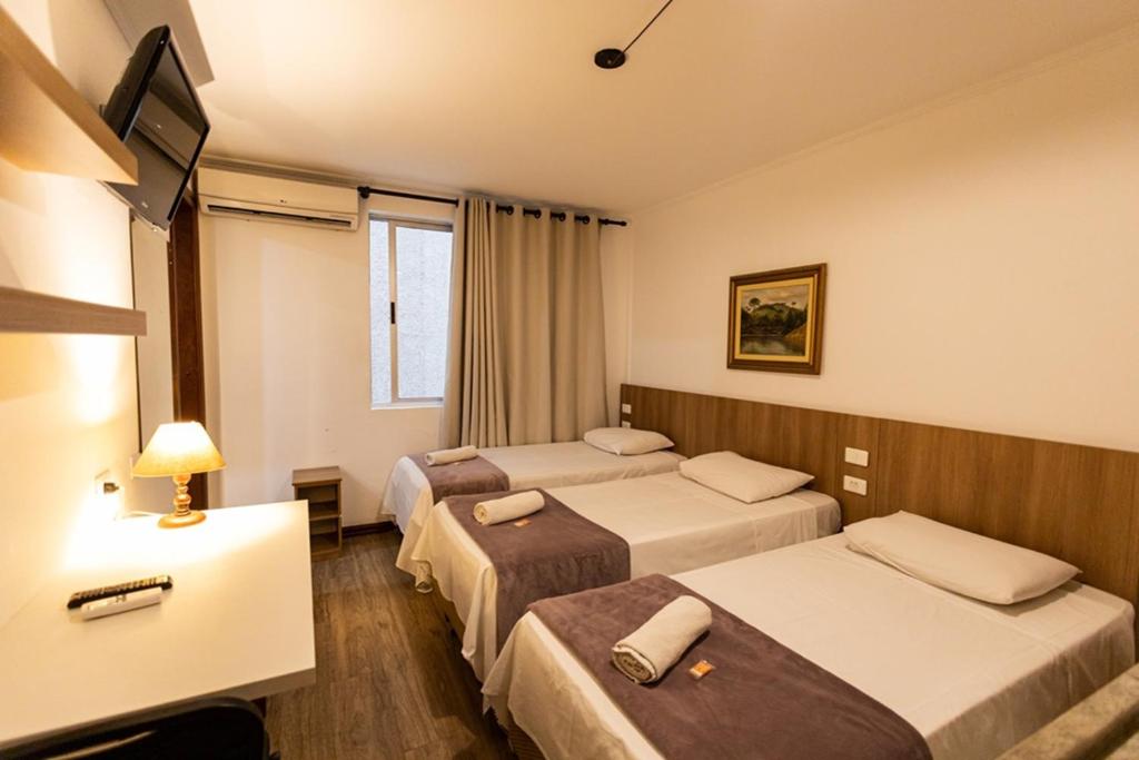 Cama ou camas em um quarto em Hotel Golden Star