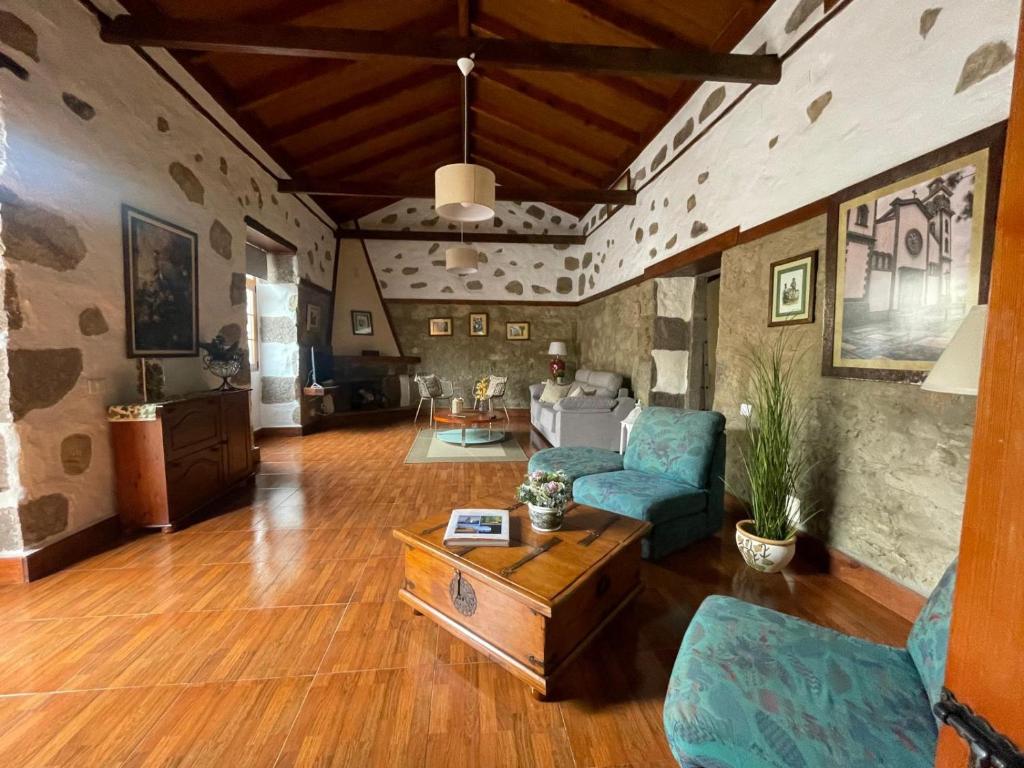 a living room with a couch and a table at Casa La Candelaria - Moya in Moya
