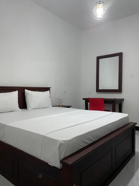 Postel nebo postele na pokoji v ubytování Golden Paradise Transit Hotel