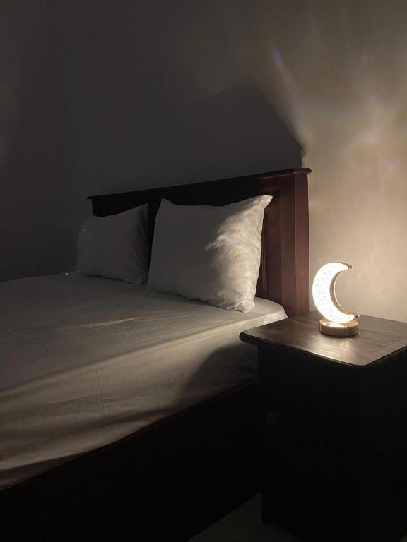 Postel nebo postele na pokoji v ubytování Golden Paradise Transit Hotel