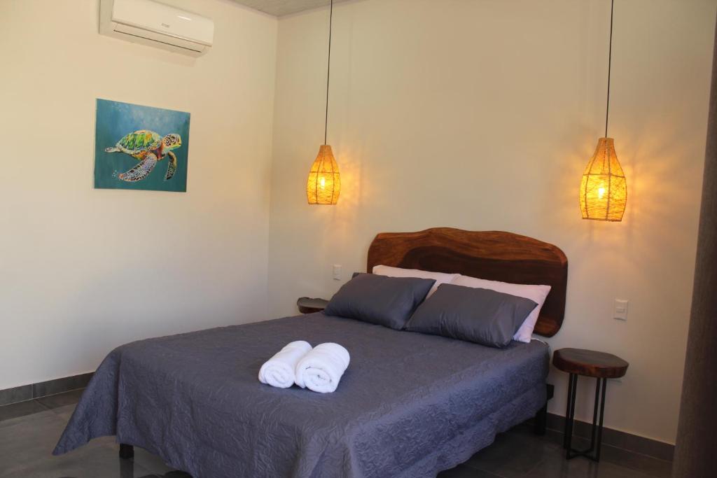 Postel nebo postele na pokoji v ubytování Hotel Huacas