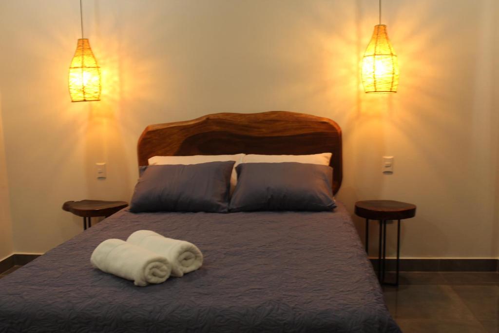 Postel nebo postele na pokoji v ubytování Hotel Huacas