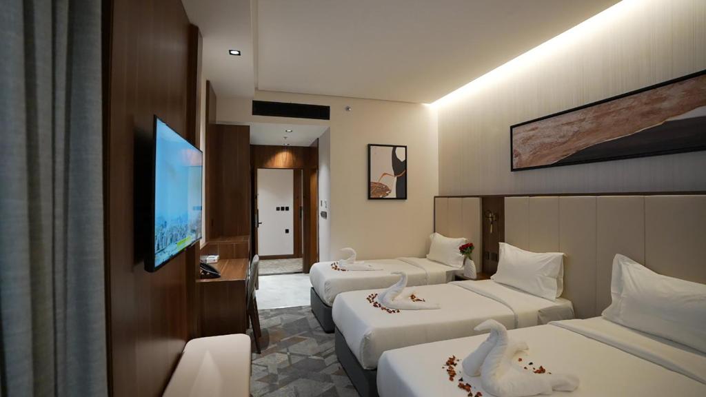 Postel nebo postele na pokoji v ubytování Ajm Mina Hotel