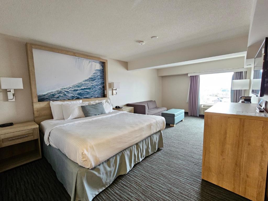 Postel nebo postele na pokoji v ubytování Vittoria Hotel & Suites