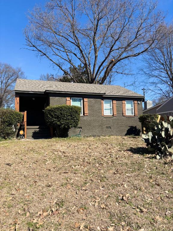 a house with a large yard in front of it at CeloVacationHousing in Memphis