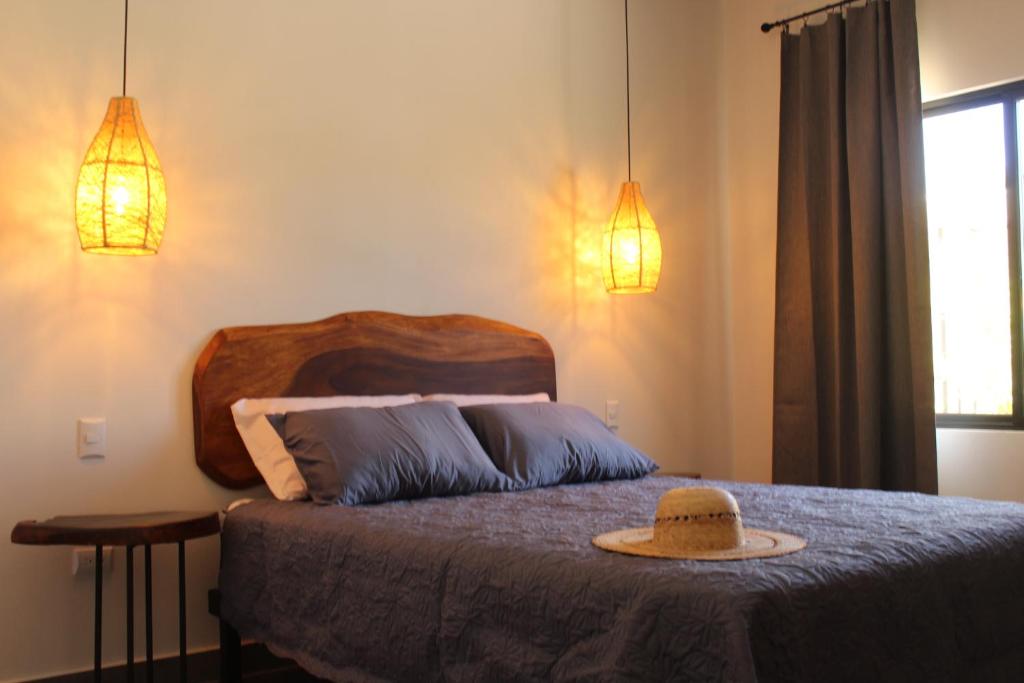 Postel nebo postele na pokoji v ubytování Hotel Huacas