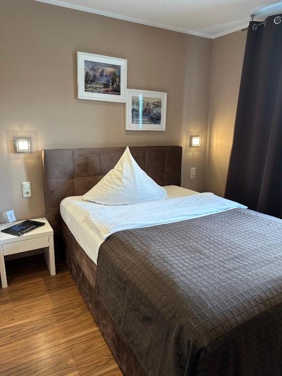 Postel nebo postele na pokoji v ubytování Pension am Zollverein