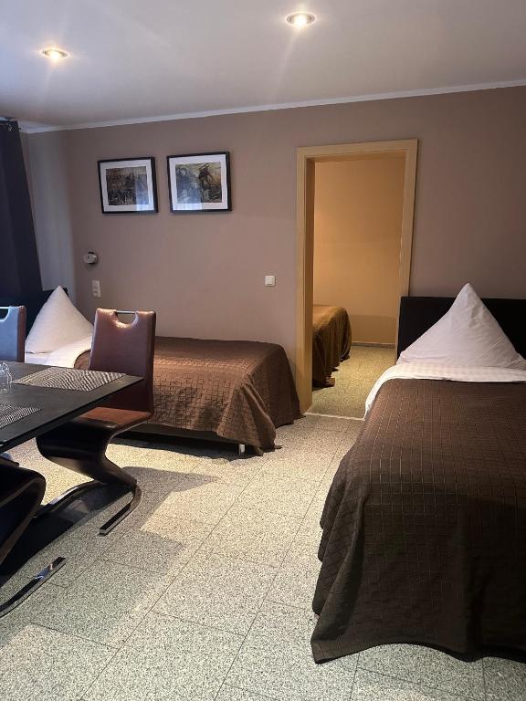 Postel nebo postele na pokoji v ubytování Pension am Zollverein