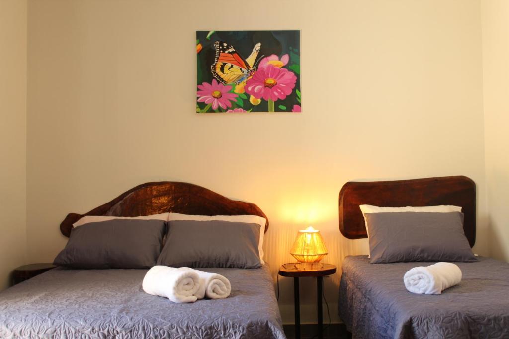 Postel nebo postele na pokoji v ubytování Hotel Huacas