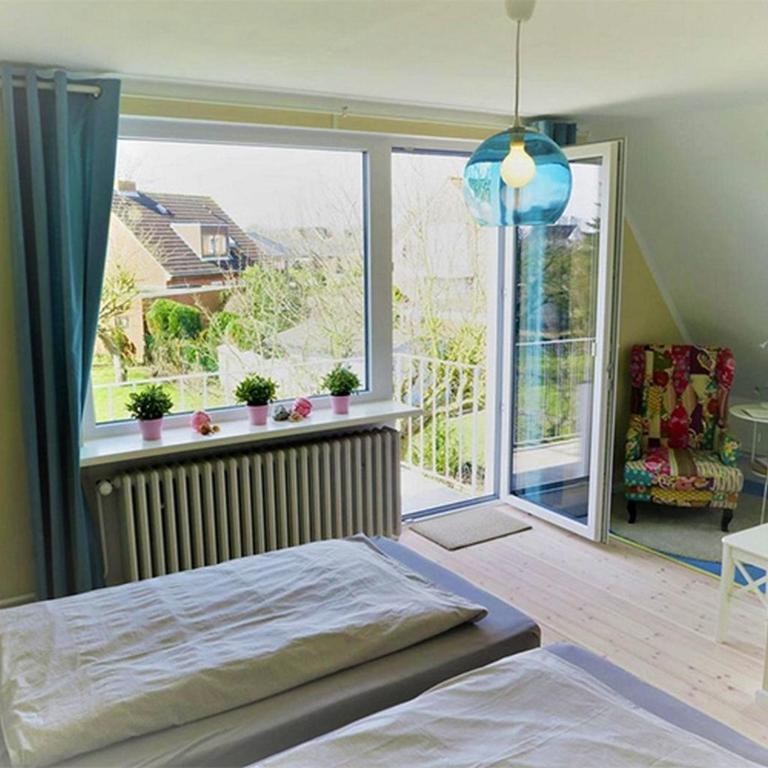 Postel nebo postele na pokoji v ubytování Dein Ferienhaus Strandstrasse