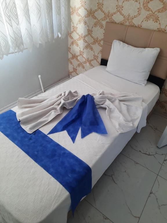 Ένα ή περισσότερα κρεβάτια σε δωμάτιο στο sanita otel