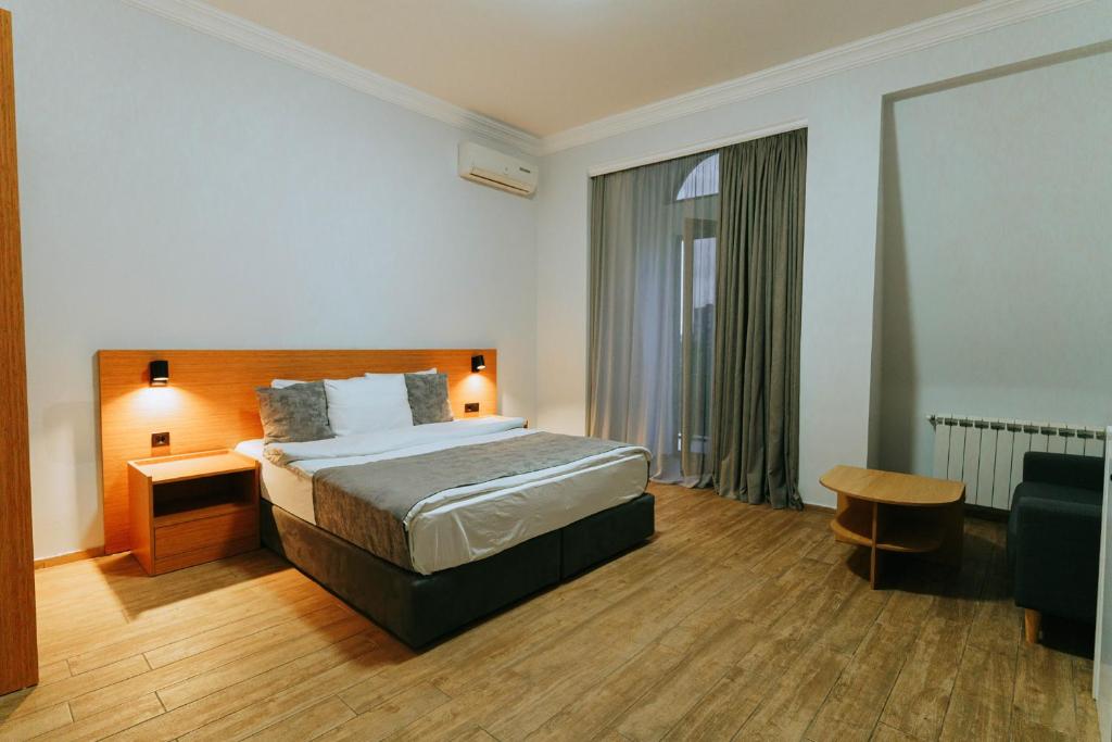 Postel nebo postele na pokoji v ubytování Hotel Old Town